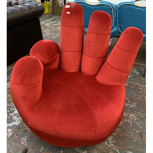 246 - A modern red fabric upholstered swivel hand chair