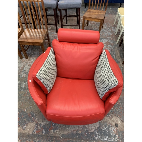 247 - A Fama red leather swivel electric reclining armchair