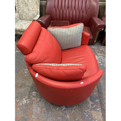 247 - A Fama red leather swivel electric reclining armchair