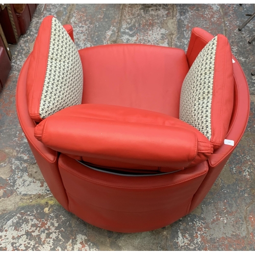 247 - A Fama red leather swivel electric reclining armchair