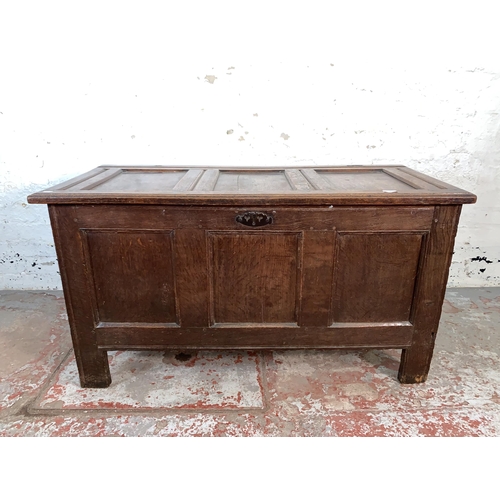 76 - A Georgian oak three panel coffer - approx. 66cm high x 121cm wide x 54cm deep