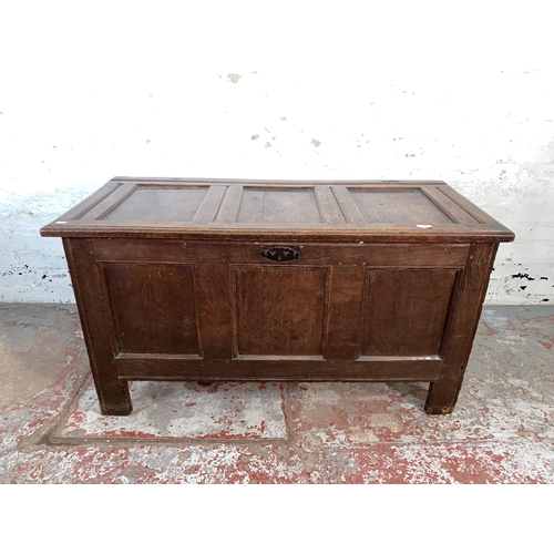 76 - A Georgian oak three panel coffer - approx. 66cm high x 121cm wide x 54cm deep