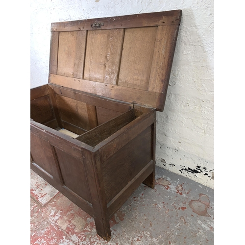 76 - A Georgian oak three panel coffer - approx. 66cm high x 121cm wide x 54cm deep