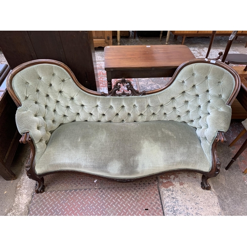 77 - A Victorian carved rosewood and green fabric upholstered double spoon back parlour sofa - approx. 80... 