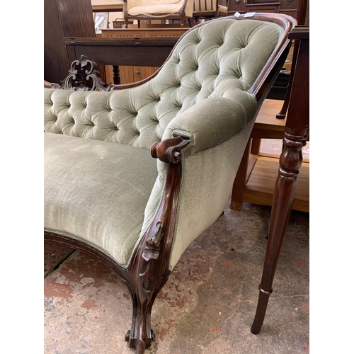 77 - A Victorian carved rosewood and green fabric upholstered double spoon back parlour sofa - approx. 80... 