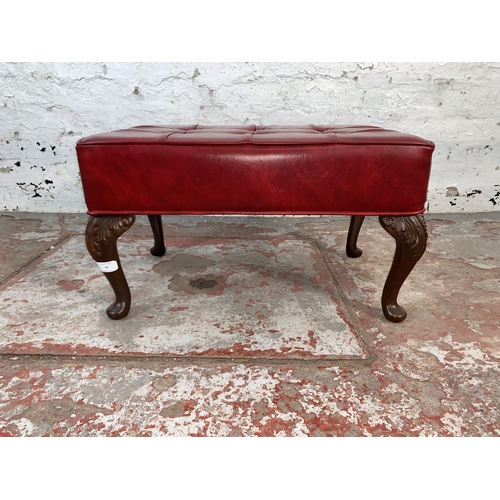 79 - A mid 20th century Sherborne red vinyl upholstered footstool on cabriole supports - approx. 32cm hig... 