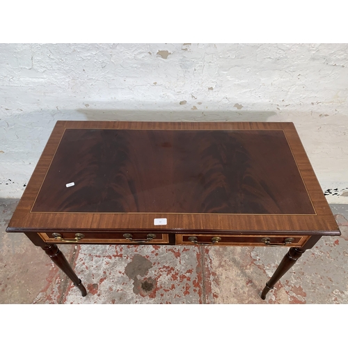 80 - A 19th century style inlaid mahogany writing table with two drawers - approx. 76cm high x 99cm wide ... 