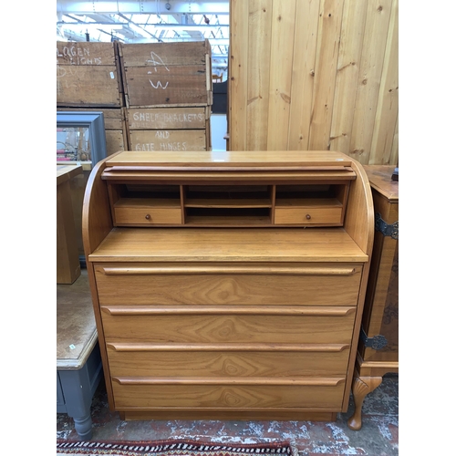 85 - A mid 20th century teak roll top bureau - approx. 100cm high x 90cm wide x 47cm deep