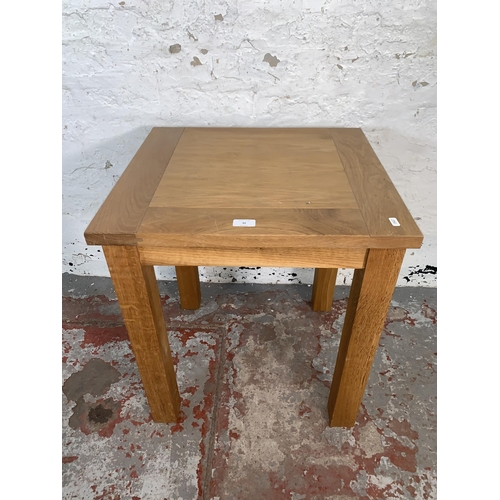 92 - A modern oak side table - approx. 62cm high x 50cm wide x 55cm deep