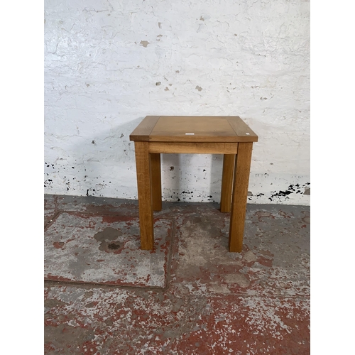 92 - A modern oak side table - approx. 62cm high x 50cm wide x 55cm deep