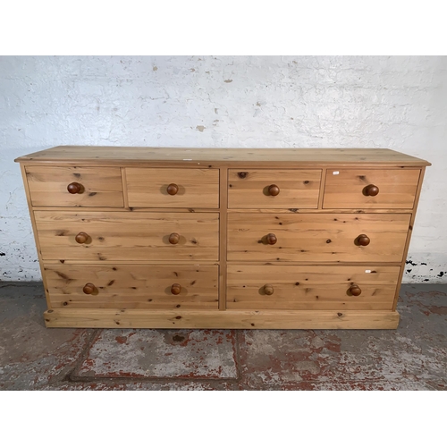 98 - A pine chest of drawers - approx. 90cm high x 185cm wide x 43cm deep