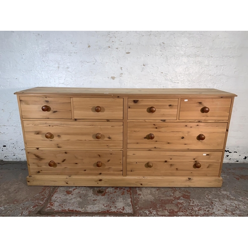 98 - A pine chest of drawers - approx. 90cm high x 185cm wide x 43cm deep