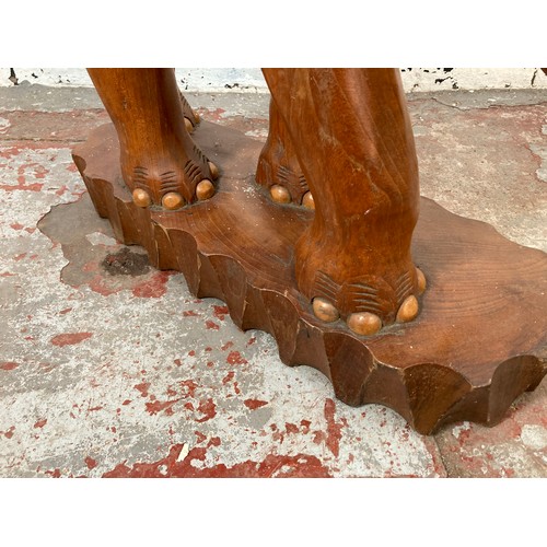 209 - A carved teak elephant statue - approx. 70cm high x 21cm wide x 58cm long