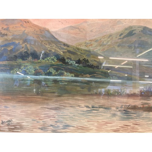 250B - A gilt framed watercolour of a landscape scene, signed lower left - approx. 72cm high x 92cm wide