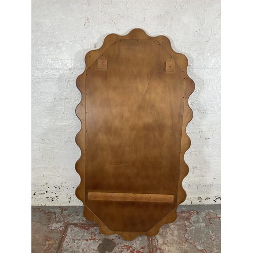 255 - An Urban Outfitters Sofia cherry wood framed wall mirror - approx. 165cm high x 89cm wide