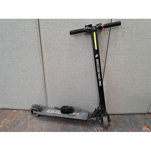 1145A - A Breezeboard Pro electric scooter with charger