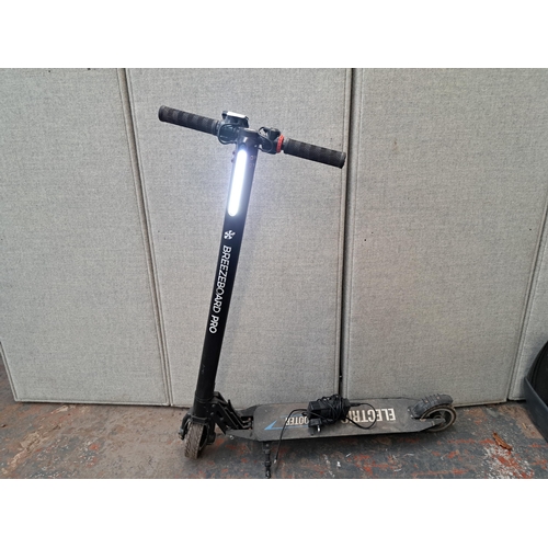 1145A - A Breezeboard Pro electric scooter with charger