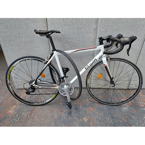 1153 - A B'twin Triban 5 road bike with Shimano brake and gear system