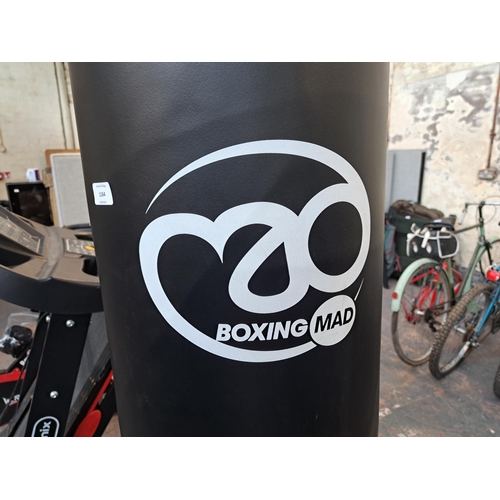 1164 - A collection of boxing equipment to include Boxing Mad upright punch bag, Lonsdale London boxing glo... 