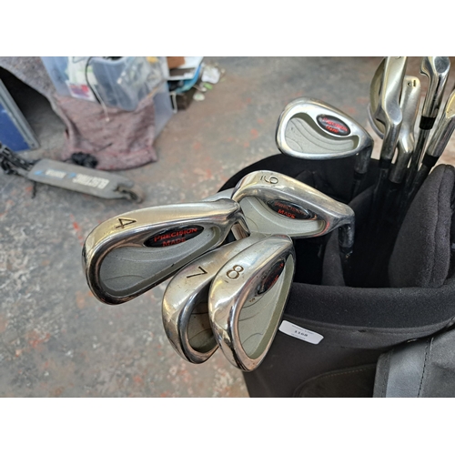 1168 - A golf bag containing a collection of golf clubs to include PMG 2 Tour Series, Apollo Seamless etc.