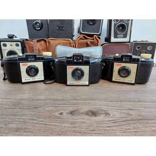 306 - Nine box cameras to include Coronet Ambassador, three Kodak Brownie 127 etc.