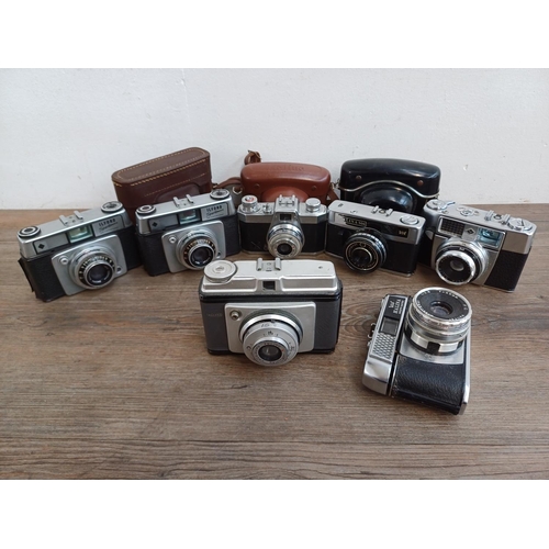 308 - Seven vintage cameras to include Halina PET, two Ilford Sportsman, Dacora Digna etc.