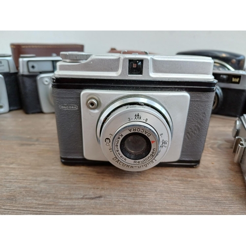 308 - Seven vintage cameras to include Halina PET, two Ilford Sportsman, Dacora Digna etc.