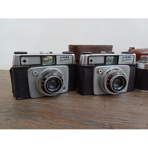 308 - Seven vintage cameras to include Halina PET, two Ilford Sportsman, Dacora Digna etc.