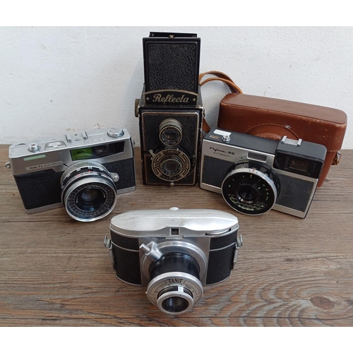 309 - Four vintage cameras, one Richter Reflecta 6x6 TLR, one cased Fujica 35 Automagic, one Petri 7s 35mm... 