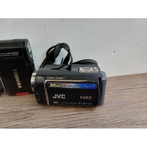 310 - Nine digital camcorders to include Vivitar, Sony Handycam, Panasonic HC-V210 10mp full HD, JVC Everi... 