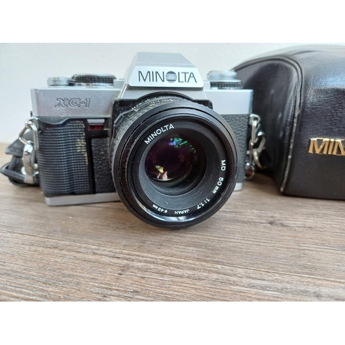 314 - Four items, one Zenza Bronica Zenzanon E II 1:2.8 f=75mm lens, one cased Minolta XG-1 35mm SLR camer... 