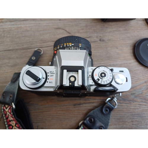 314 - Four items, one Zenza Bronica Zenzanon E II 1:2.8 f=75mm lens, one cased Minolta XG-1 35mm SLR camer... 