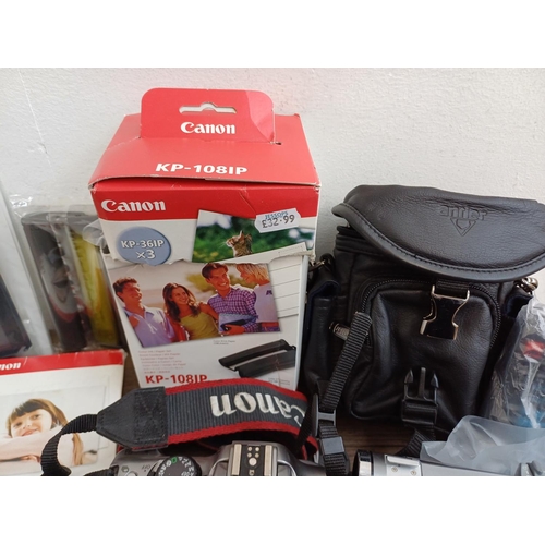 319 - A collection of Canon items to include EOS 300D 6mp DSLR camera, cased Speedlite 420EX flash, boxed ... 