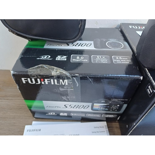 327 - Two boxed Fujifilm digital cameras, one X-T10 16mp with instruction manual and charger and one cased... 