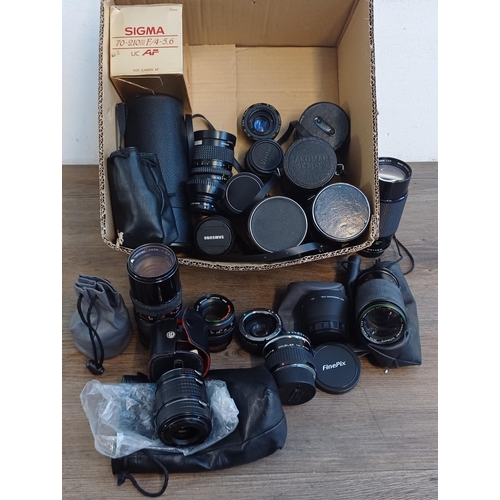 329 - A collection of converters and lenses to include Schneider D-Xenon, Minolta, boxed Sigma, Asahi Supe... 