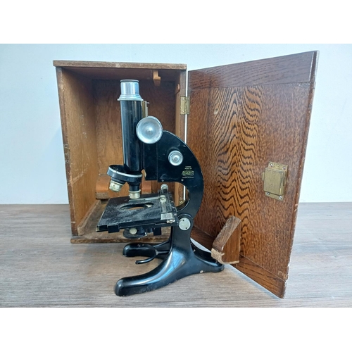 334 - A cased mid 20th century R & J Beck model 29 microscope