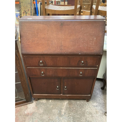 10 - Two pieces of furniture, one early 20th century oak bookcase top with two leaded glass doors and one... 