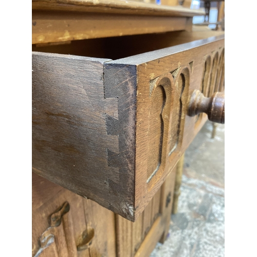 113 - An L. Marcus Ltd. carved oak linenfold sideboard - approx. 93cm high x 122cm wide x 48cm deep