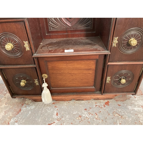 114 - An Edwardian carved mahogany wall mountable cabinet - approx. 60cm high x 73cm wide x 21cm deep