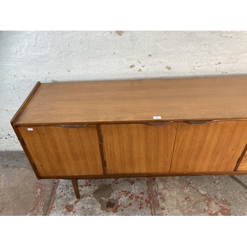 117 - A mid 20th century teak sideboard - approx. 73cm high x 167cm wide x 44cm deep