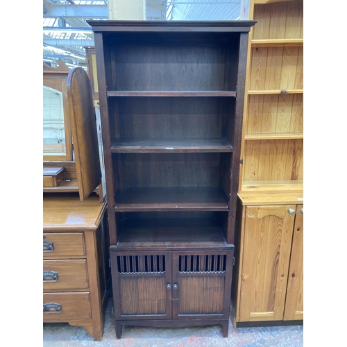 119 - A modern hardwood four tier bookcase - approx. 181cm high x 75cm wide x 40cm deep