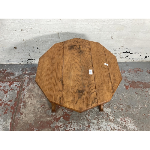 121 - A mid 20th century oak drop leaf side table