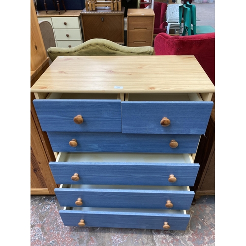 122 - A modern pine effect and blue painted chest of drawers - approx. 90cm high x 77cm wide x 40cm deep