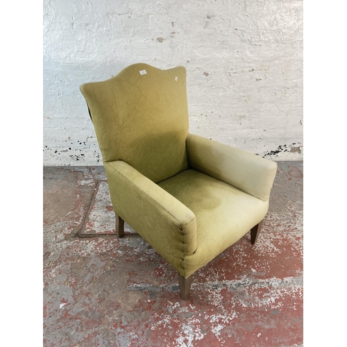 127 - An early/mid 20th century green fabric upholstered armchair