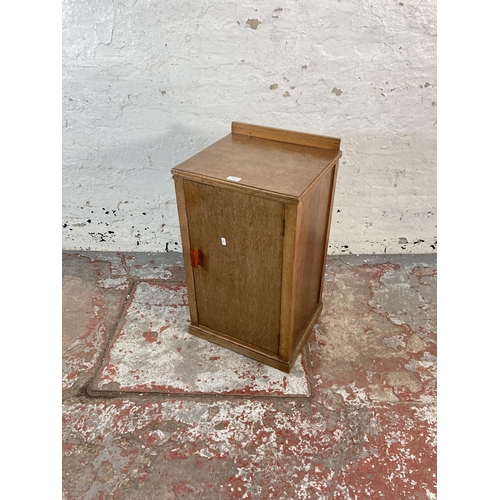 129 - An Art Deco oak bedside cabinet - approx. 72cm high x 41cm wide x 36cm deep