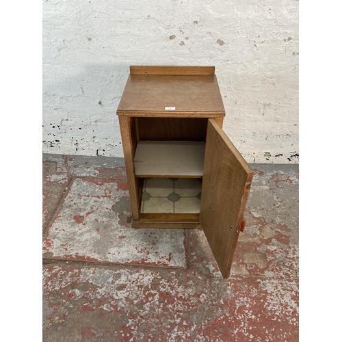 129 - An Art Deco oak bedside cabinet - approx. 72cm high x 41cm wide x 36cm deep