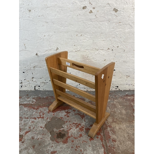 136 - An oak magazine rack - approx. 48cm high