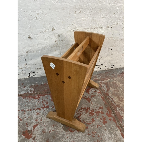 136 - An oak magazine rack - approx. 48cm high