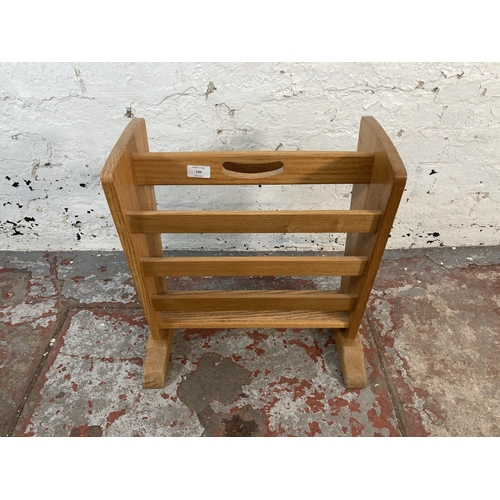 136 - An oak magazine rack - approx. 48cm high