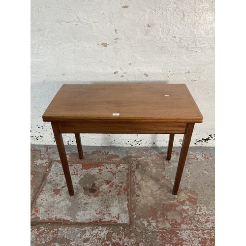 138 - A 19th century inlaid mahogany fold over tea table - approx. 75cm high x 91cm wide x 45cm deep when ... 